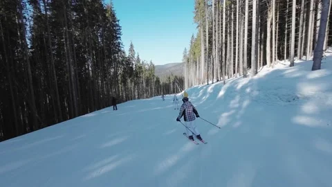 Skiing on the ski slopes on ski holidays travel vacation Video stock 218872464