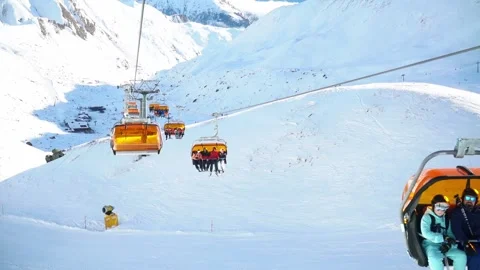 Skiing. Ski vacation. Rest in the mountains in the winter season. Skis, snowboar Stock Footage 242802698