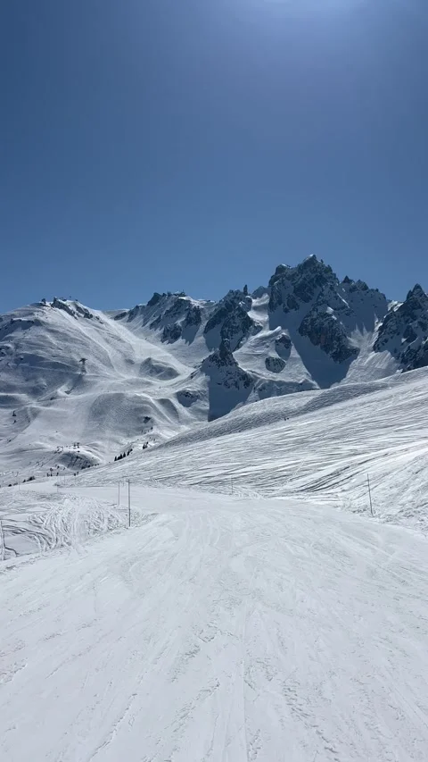 Skiing on the slopes of Courchevel Stock Footage 334439761