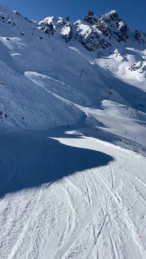 Skiing on the slopes of Courchevel Stock Footage 336928627