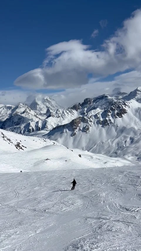 Skiing on the slopes of Courchevel Stock Footage 336928709