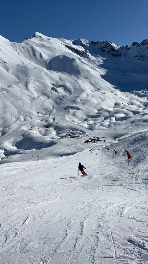 Skiing on the slopes of Courchevel Stock Footage 337054505