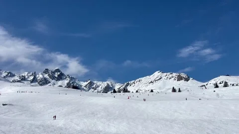 Skiing on the slopes of Courchevel	ski resort, French alps by winter Stock Footage 337052177
