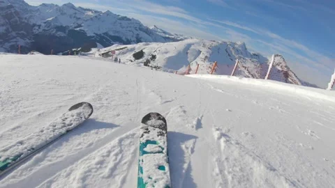 Skiing on snow slopes in the mountains, first person view - Man going downhil Stock Footage 141924800