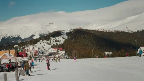 Skiing on the track against the backdrop of picturesque snow capped mountains. Stock Footage 296592749
