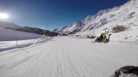 Skiing on a trail while passing a snowmobile Video stock 83704553