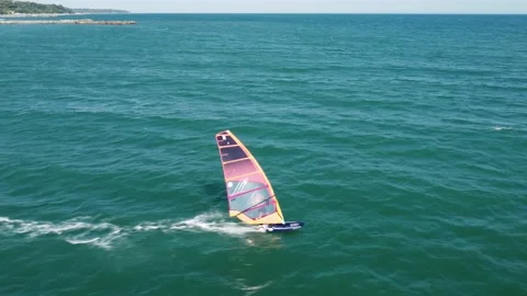 Skiing windsurfing in the sea at sunset Stock Footage 205076219