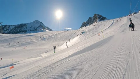 Skiing in winter Alpine resort of Kaprun in Austria, sunny day on ski vacation Stock Footage 307702106