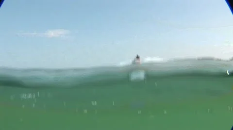 Skijet passing underwater camera making waves Stock Footage 42368386
