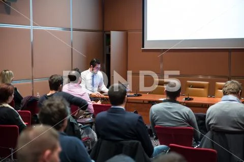 Skiled Public Speaker Giving a Talk at Business Meeting. Stock Photos