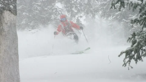 Skilful skier skiing downhill during a snowfall Stock Footage 116745461