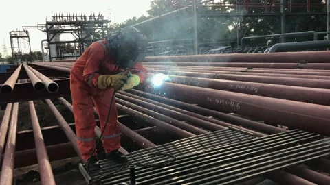 Skill welder doing welding of mild steel pipe at 6G position. Stock Footage 159780115