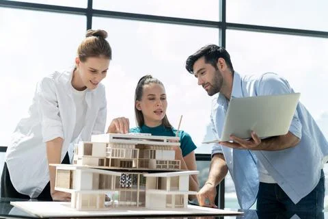 Skilled architect holding laptop while present idea to engineer team. Tracery. Foto stock