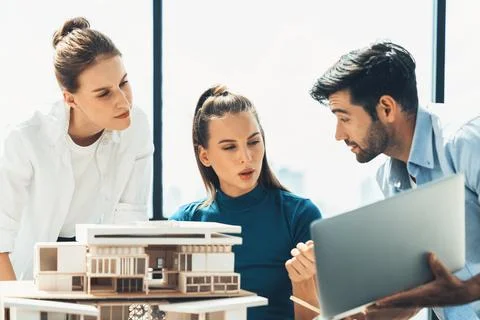 Skilled architect holding laptop while present idea to engineer team. Tracery. Foto stock