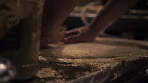 The skilled artisan is using their hands to shape dough Stock Footage 278155632