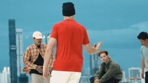 Skilled break dancer doing freeze pose at roof top with city view. hiphop. Stock-Footage 264079383