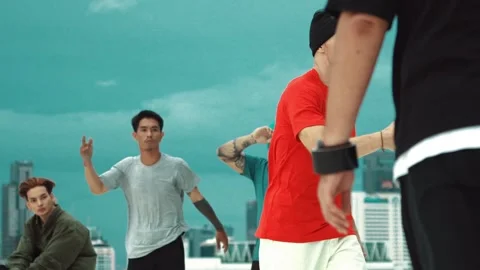 Skilled break dancer doing freeze pose at roof top with city view. hiphop. Stock Footage 272577742