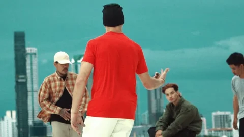 Skilled break dancer doing freeze pose at roof top with city view. hiphop. Stock Footage 274159862