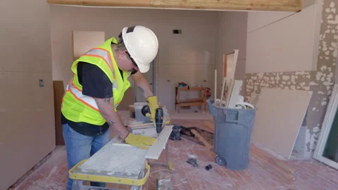 Skilled builders are working together on a house renovation, showcasing teamwork Stock Footage 306046652