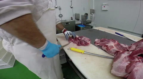 Skilled Butcher in Action With a Sharp Knife Stock Footage 59387276