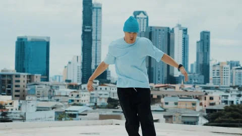 Skilled caucasian B-boy dancer practicing street dancing at rooftop. hiphop. Stock Footage 258270758