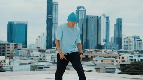 Skilled caucasian B-boy dancer practicing street dancing at rooftop. hiphop. Stock Footage 261127097