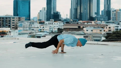 Skilled caucasian B-boy dancer practicing street dancing at rooftop. hiphop. Stock Footage 261723012