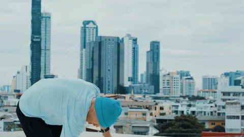 Skilled caucasian B-boy dancer practicing street dancing at rooftop. hiphop. Stock Footage 262568304