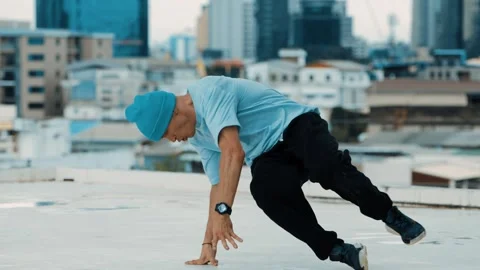 Skilled caucasian B-boy dancer practicing street dancing at rooftop. hiphop. Stock Footage 263270408
