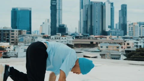 Skilled caucasian B-boy dancer practicing street dancing at rooftop. hiphop. Stock Footage 263728519