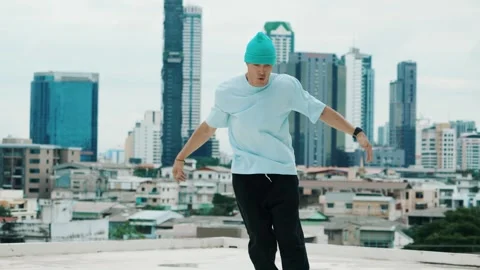 Skilled caucasian B-boy dancer practicing street dancing at rooftop. hiphop. Stock Footage 268964569