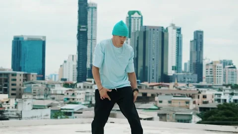 Skilled caucasian B-boy dancer practicing street dancing at rooftop. hiphop. Stock Footage 271580352