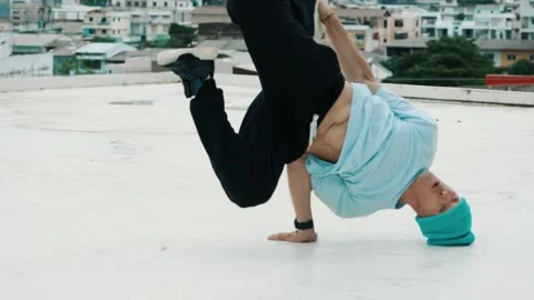Skilled caucasian B-boy dancer practicing street dancing at rooftop. hiphop. Stock Footage 275134958