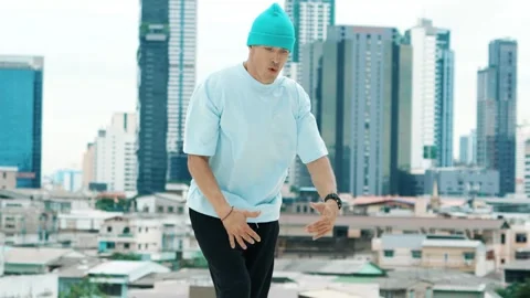 Skilled caucasian B-boy dancer practicing street dancing at rooftop. hiphop. Stock Footage 275633394