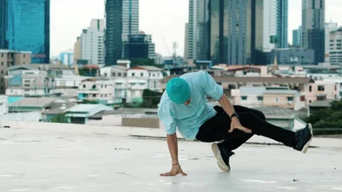 Skilled caucasian B-boy dancer practicing street dancing at rooftop. hiphop. Stock Footage 277157309