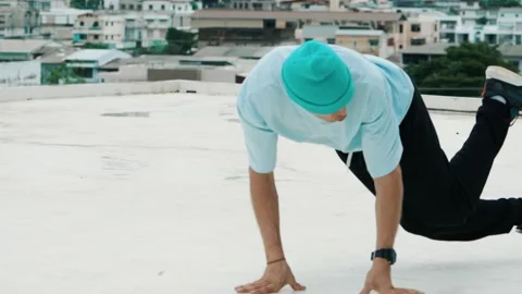 Skilled caucasian B-boy dancer practicing street dancing at rooftop. hiphop. Stock Footage 277217340