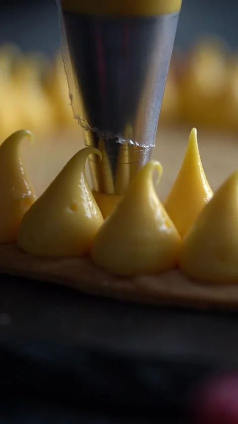 A skilled chef adding smooth cream to a delicious cake, close up shot, insert Stock Footage 328212346