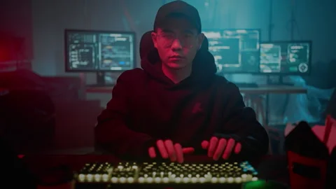 Skilled computer cracker typing on modern keyboard indoors Stock-Footage 257384249