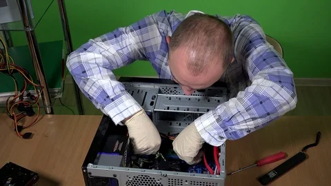Skilled computer service worker man installing ram memory into desktop pc Stock Footage 74098981