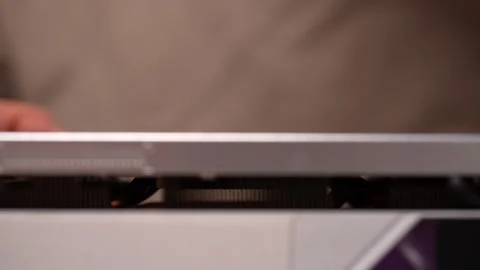 Skilled computer technician opening case of personal computer to perform Stock Footage 289021633