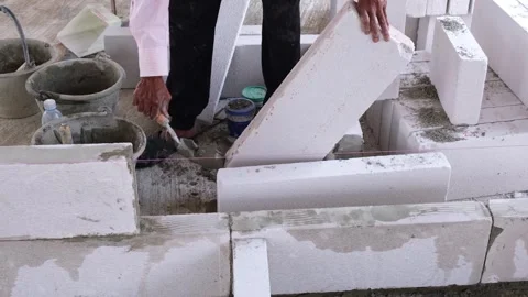 A skilled construction worker is using specialized equipment to apply adhes.. Stock Footage 300079668