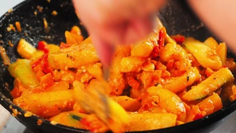 A skilled cook prepares a vibrant vegetable stir-fry using fresh produce. The Video stock 316661942