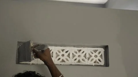 Skilled Craftsman Applying Cement to Decorative Concrete Design Stock Footage 314481879
