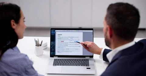 Skilled Editor Reviews Manuscript For Errors On Computer At Home. Stock Photos