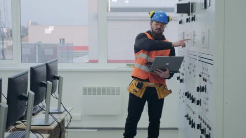 Skilled electric engineers discuss power station operation Stock Footage 143082360