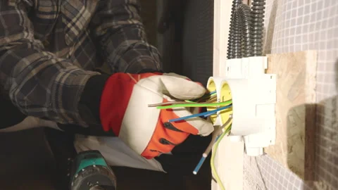 Skilled Electrician Performs Wiring Installation in Home Renovation Project Stock Footage 301971989