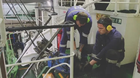 Skilled engineers work hard repairing tanker electric motor Stock-Footage 130995329