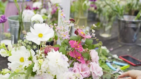 Skilled florist decorating table before event Video stock 148020044