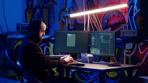 Skilled hacker deploying malware on unaware victims computers Stock Footage 319530968