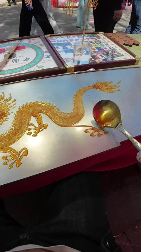 Skilled Hand Creating Golden Dragon Sugar Painting Traditional Chinese Art China Stock Footage 339652074